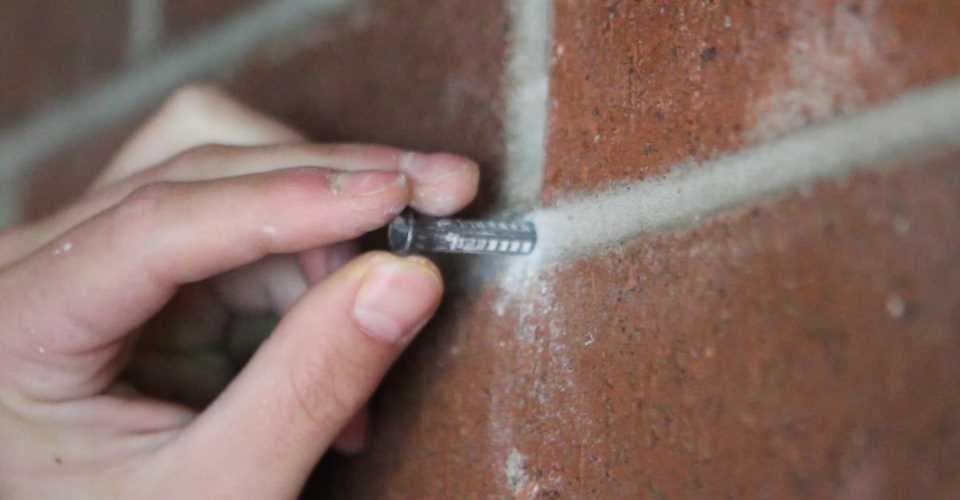 Step-by-Step Guide: How to Drill into a Brick Wall 3. Mark the screw or hook locations
