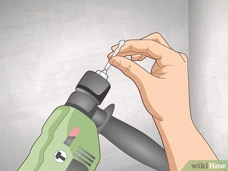 How to Hammer a Nail into a Concrete Wall without a Drill 2. Use adhesive tape