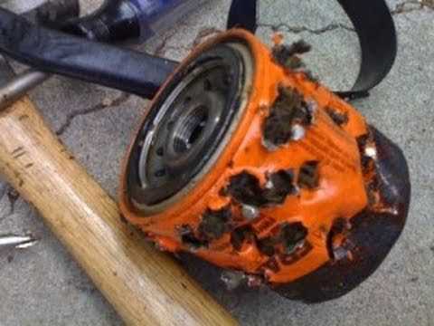 How to Remove an Oil Filter Without a Wrench | Easy DIY Guide 3. Screwdriver and hammer method