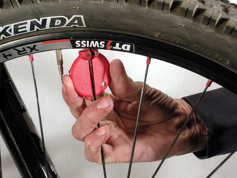 How to True a Bike Wheel Without a Spoke Wrench - Easy DIY Guide Step 3: Loosen the affected spoke