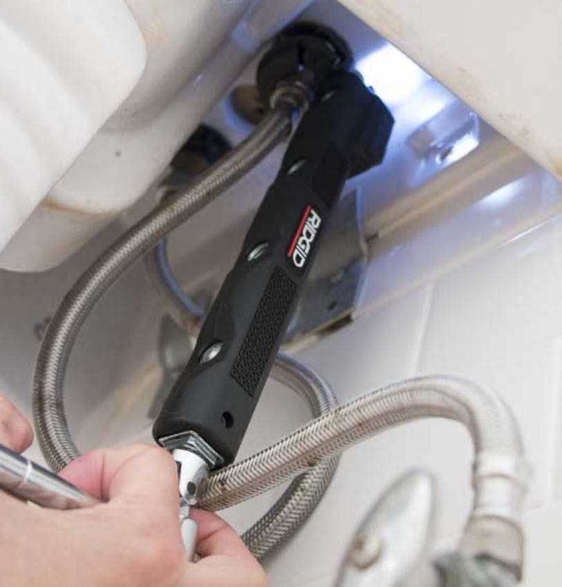 Using the Basin Wrench to Loosen the Nuts