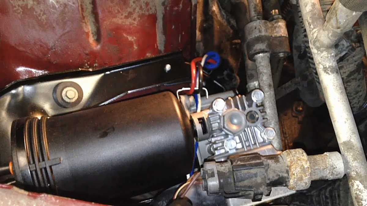 Locating the Air Suspension Compressor on a Lincoln Town Car Removing the Plastic Cover